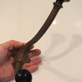 Old large hook Napoleon III in brass and earthenware