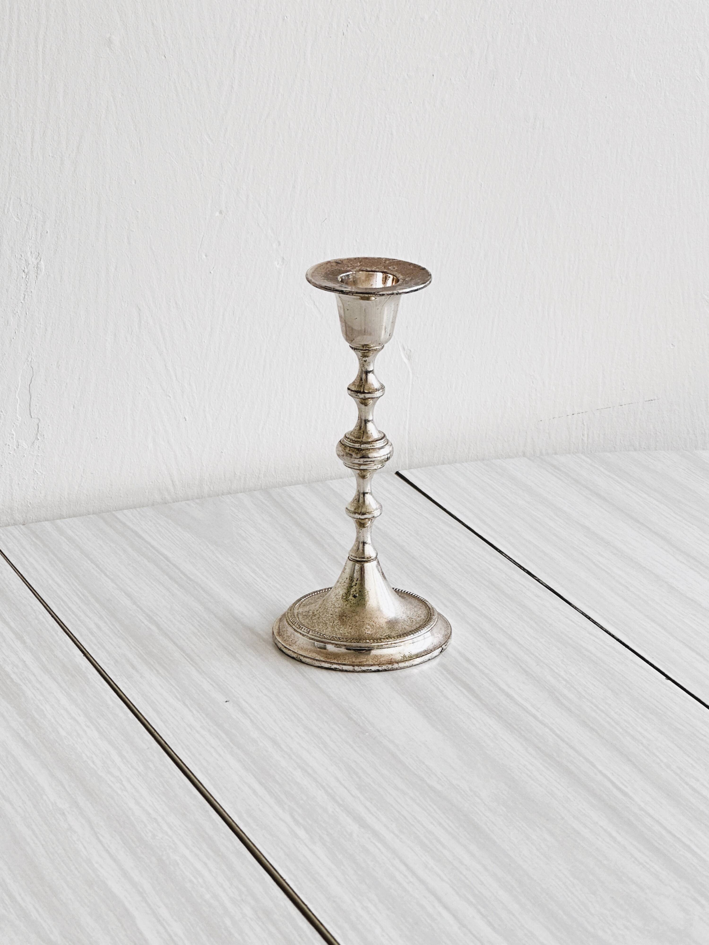 Small patinated candle holder.