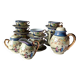 Vintage Japanese fine porcelain tea set with landscape pattern.