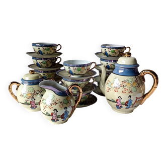 Vintage Japanese fine porcelain tea service with landscape pattern.