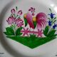 Hand-painted plate decorated with saint clement rooster signed