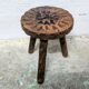 Carved wooden tripod stool