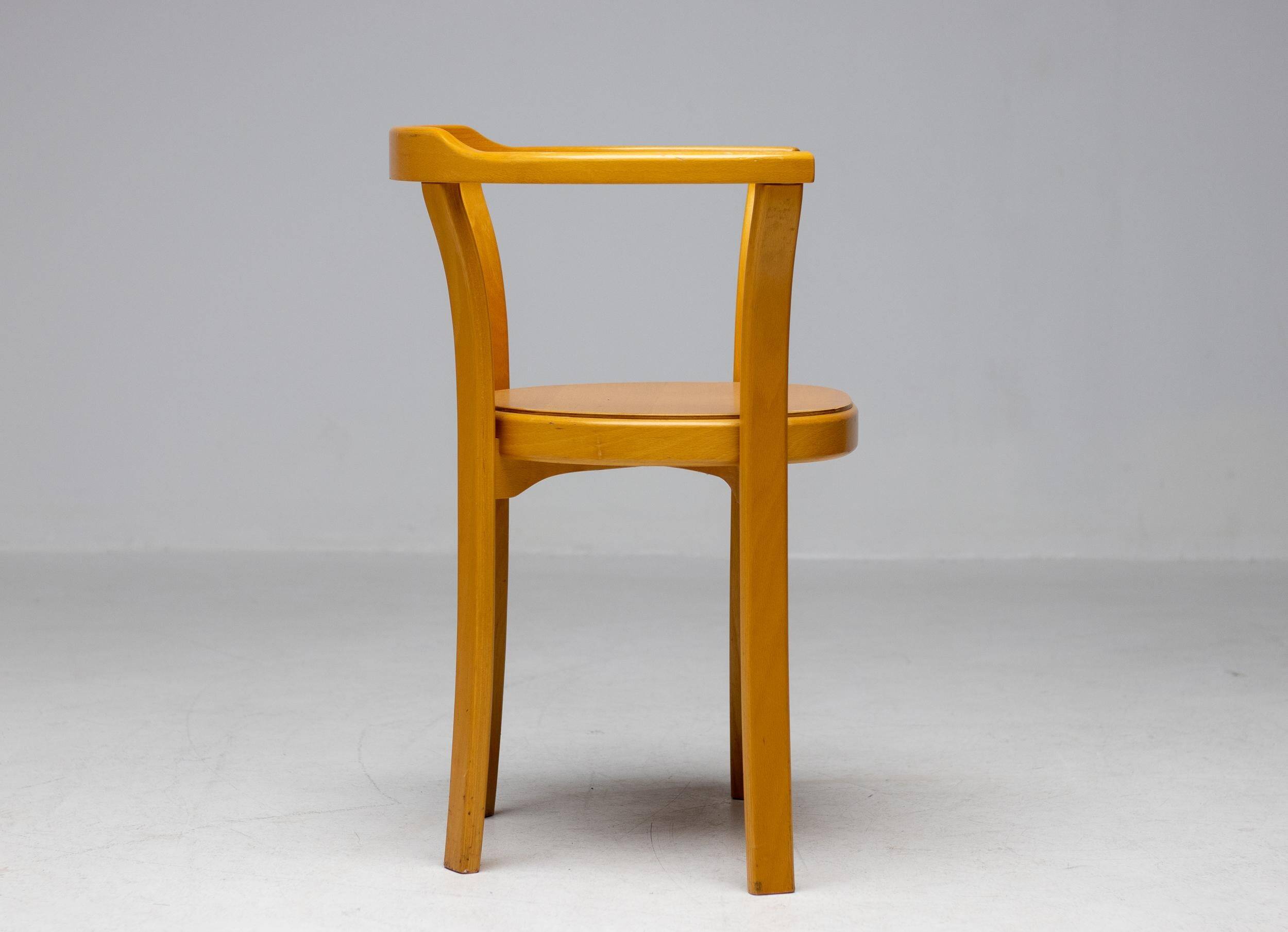 Stackable chairs in curved beech.