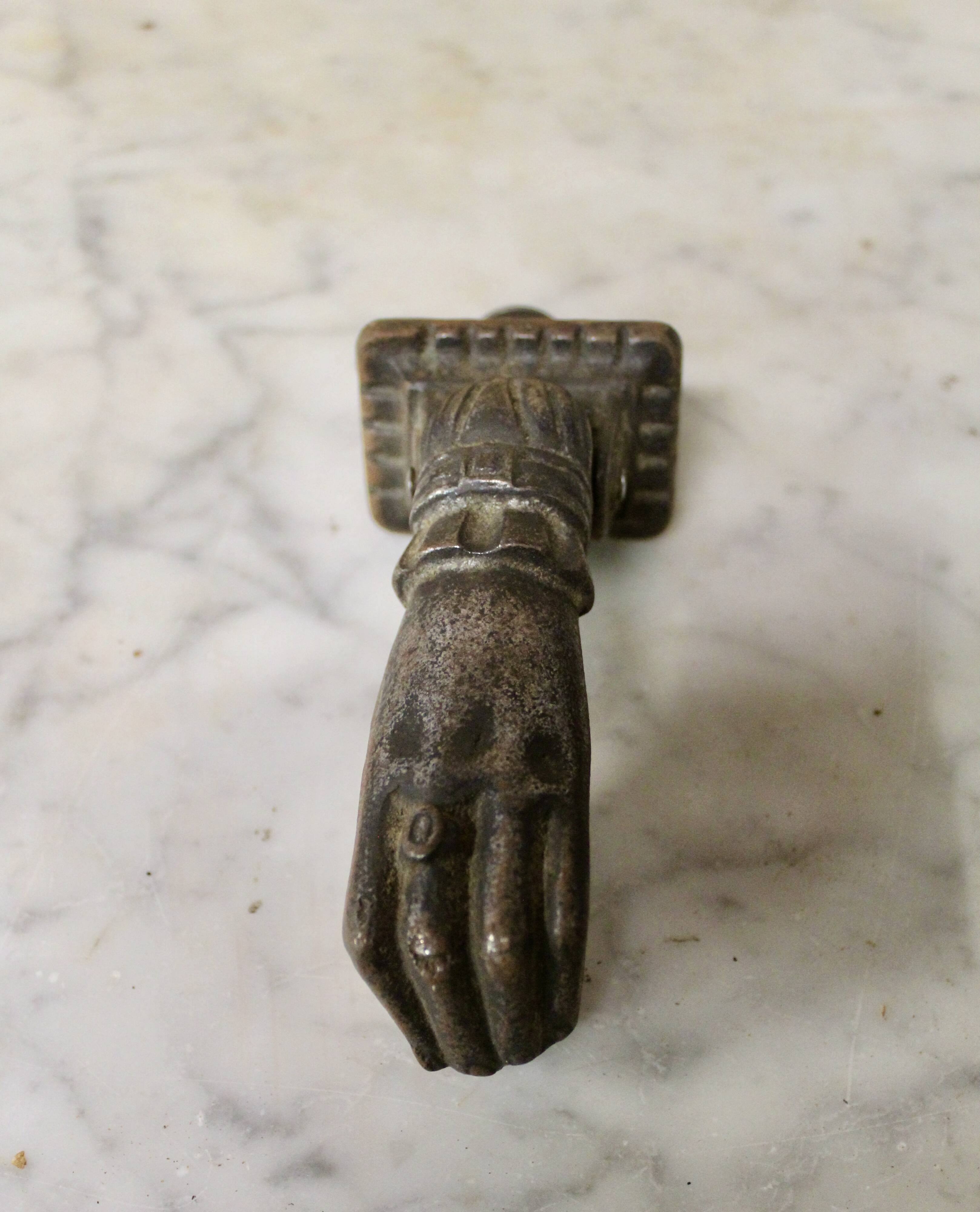 19th century cast iron door knocker, hand shape
