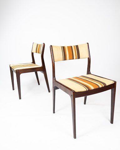 Pair of chairs in dark wood upholstered with light striped fabric of danish design