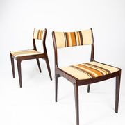 Pair of chairs in dark wood upholstered with light striped fabric of danish design