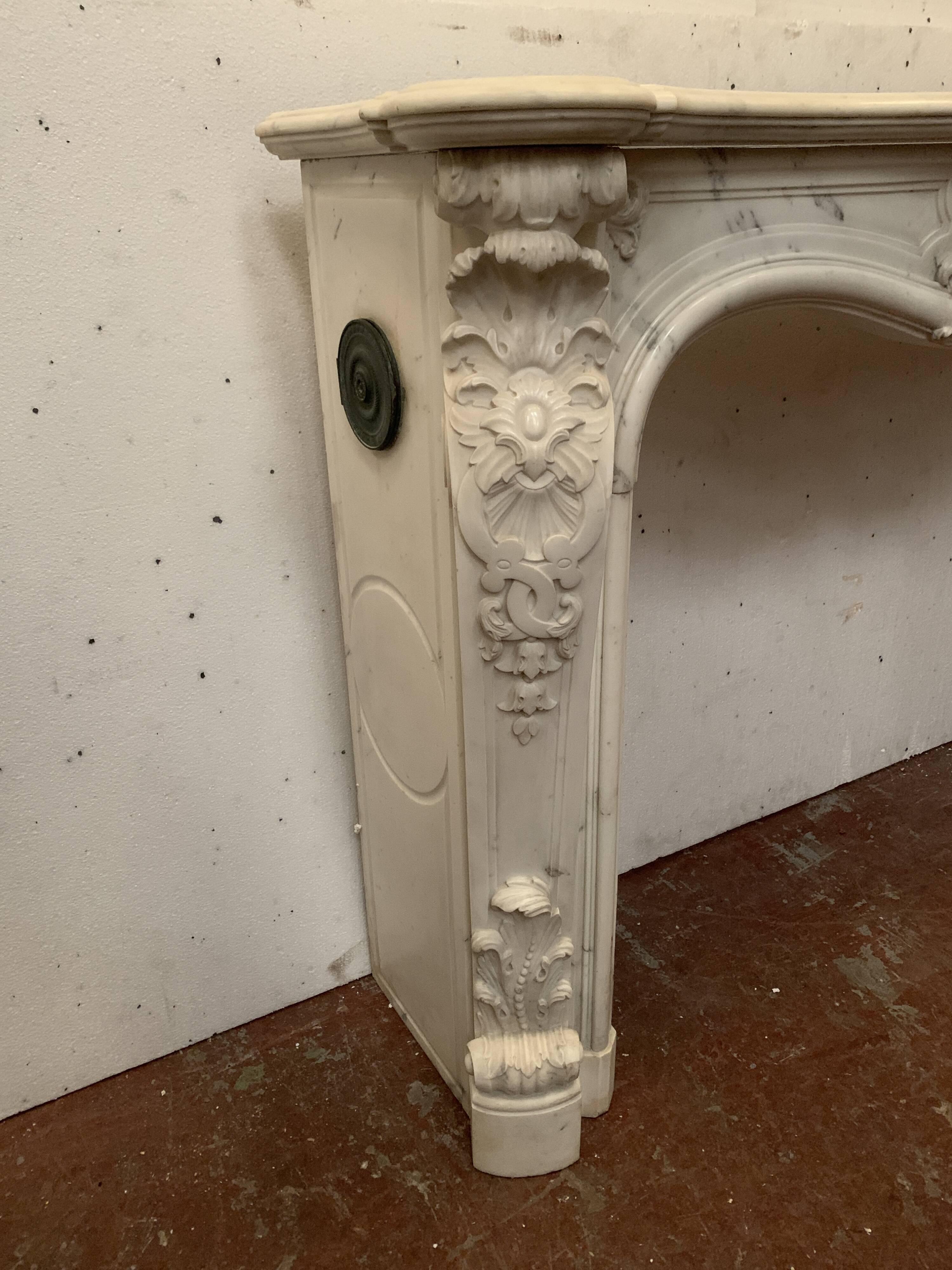 Louis XV style fireplace in white Carrara marble, 19th century