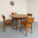 Oval dining table in solid wood with turned legs from the 1950s.