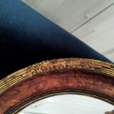 Golden oval art deco mirror