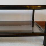 Black and gold coffee table with a double smoked glass top
