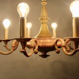 Bronze chandelier with double patina and 8 light arms.