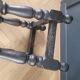Antique wooden stool with turned legs.