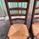 Duo of vintage rustic straw straw chairs in oak.