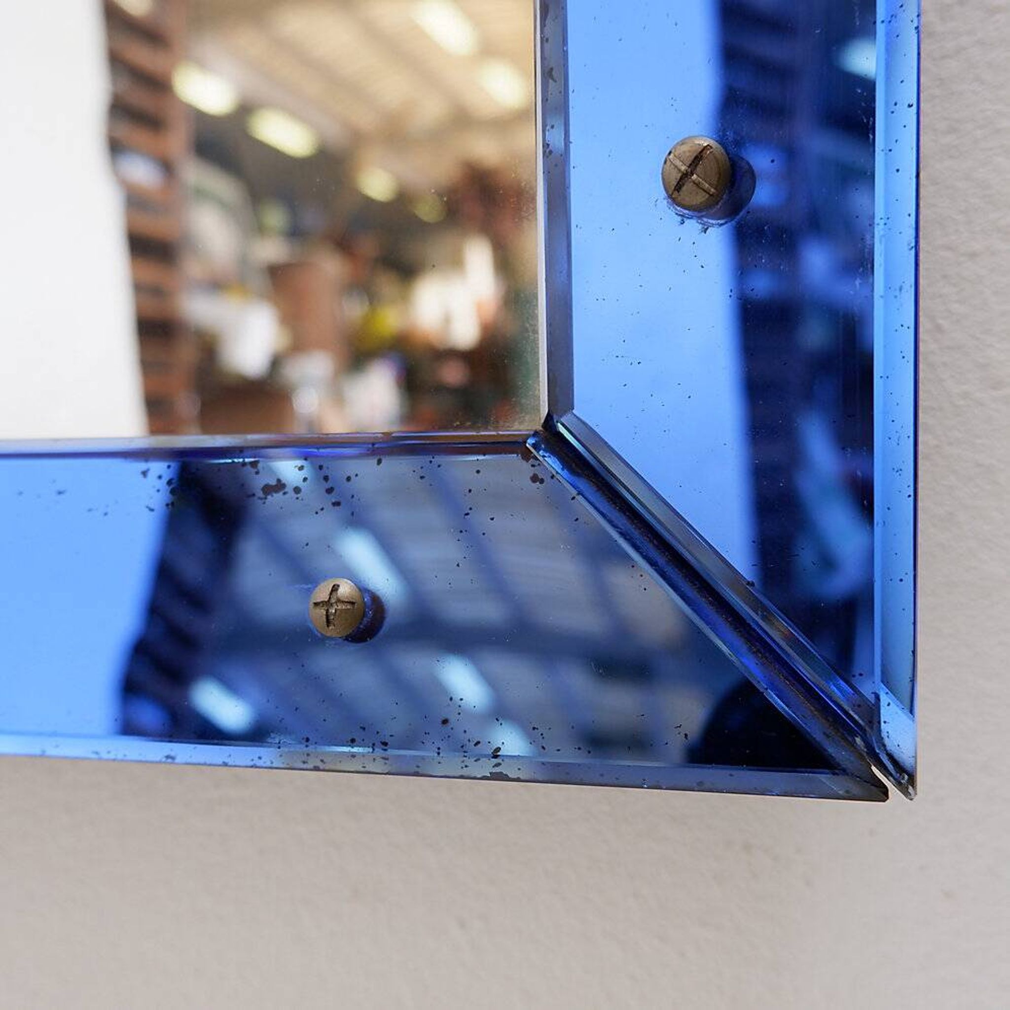 Mirror with coloured glass frame, Italy, circa 1950.