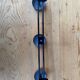 Wall coat holder in vintage red metal.