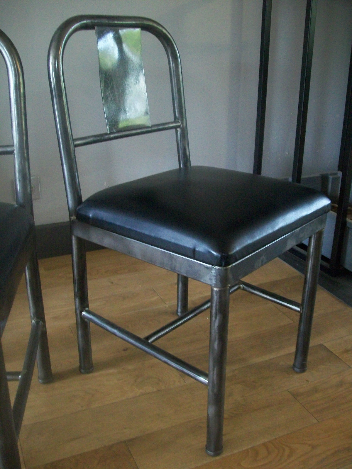Pair of metal and industrial design leatherette chairs