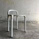 White molded plastic Kartell stool with metal legs — Anna Castelli Ferrieri, 1970s