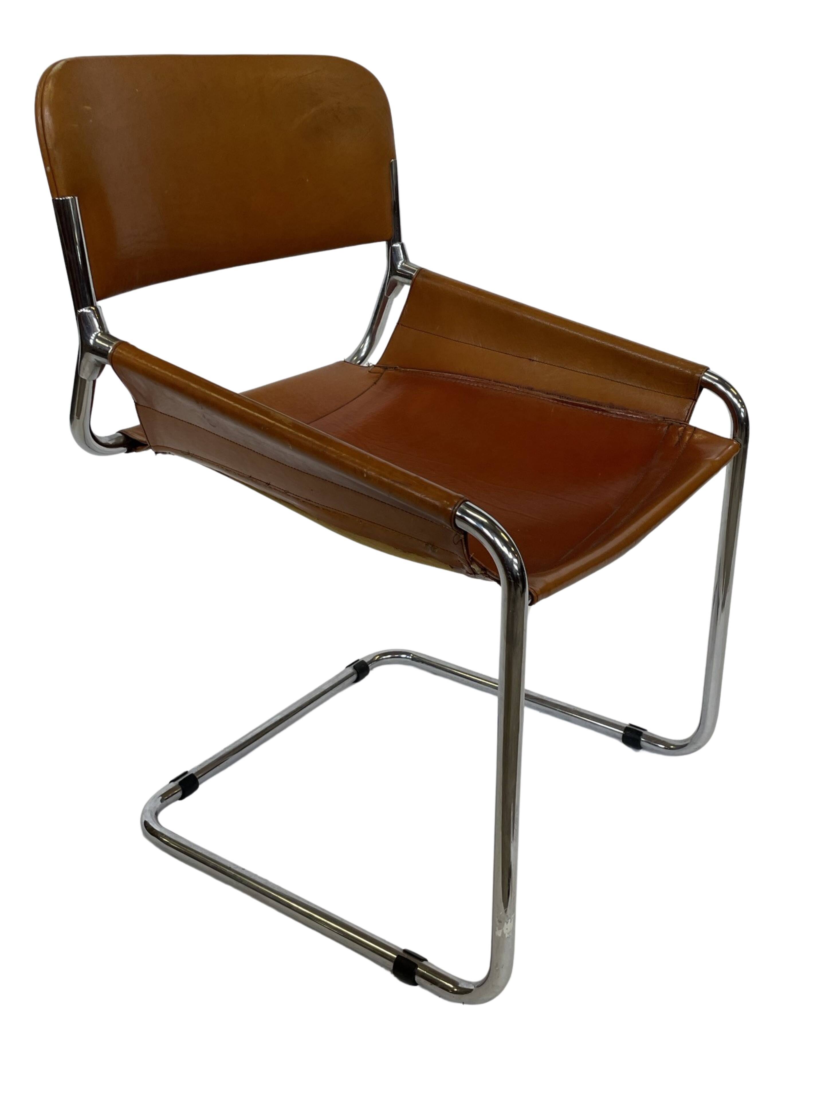 vintage dining room chair in cognac leather and chrome 1970s Italy