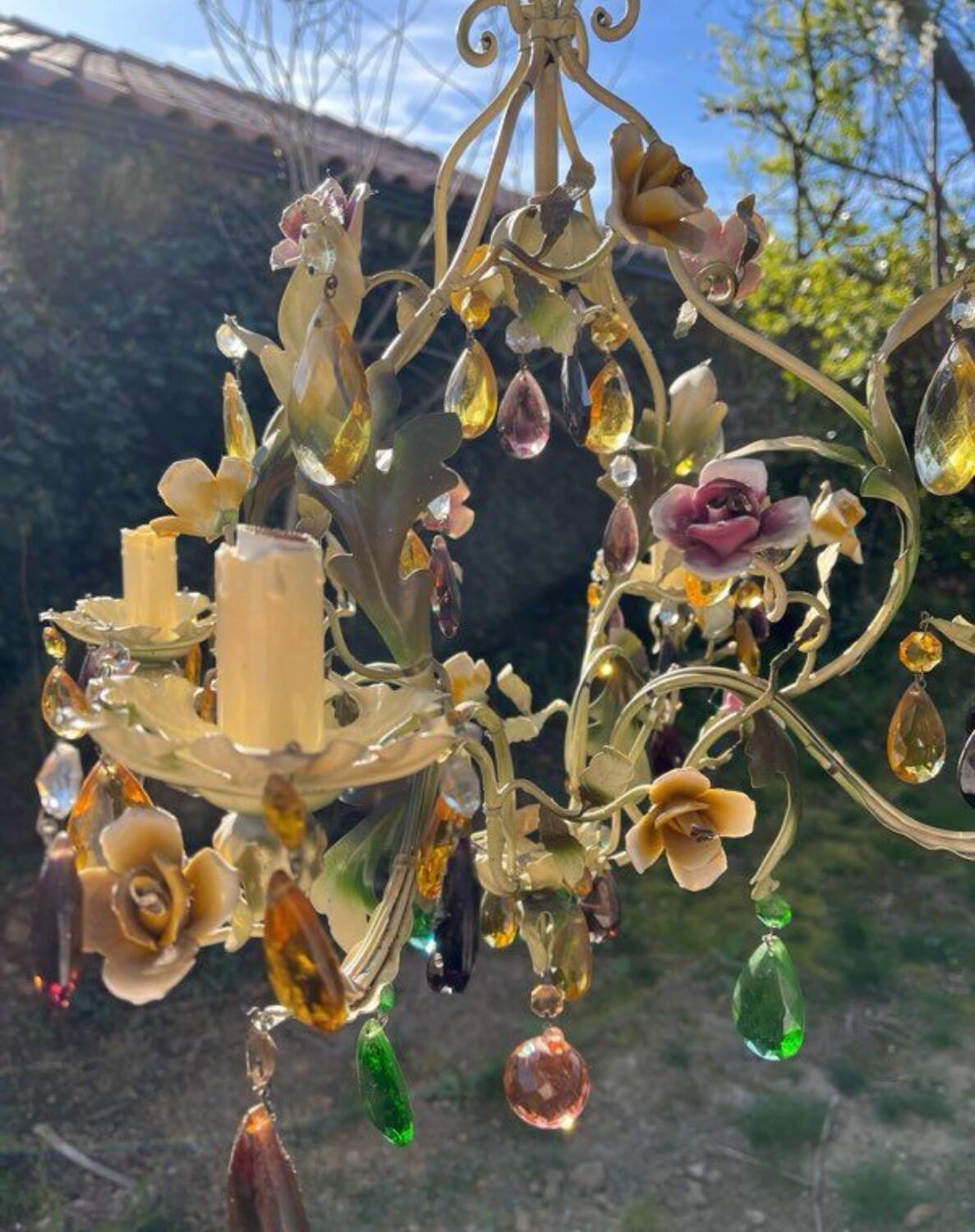 Vintage metal chandelier with porcelain flowers.