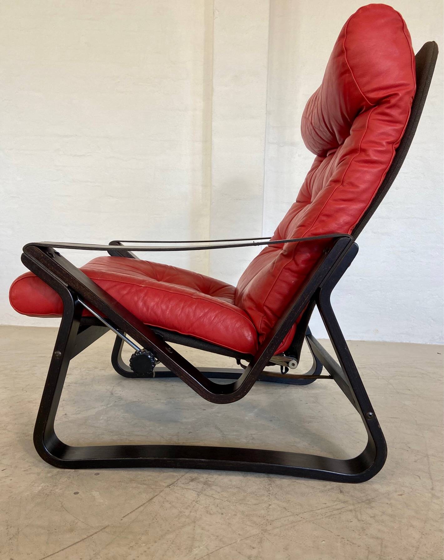 Vintage danish retro reclining lounge chair & stool in red leather by komfo