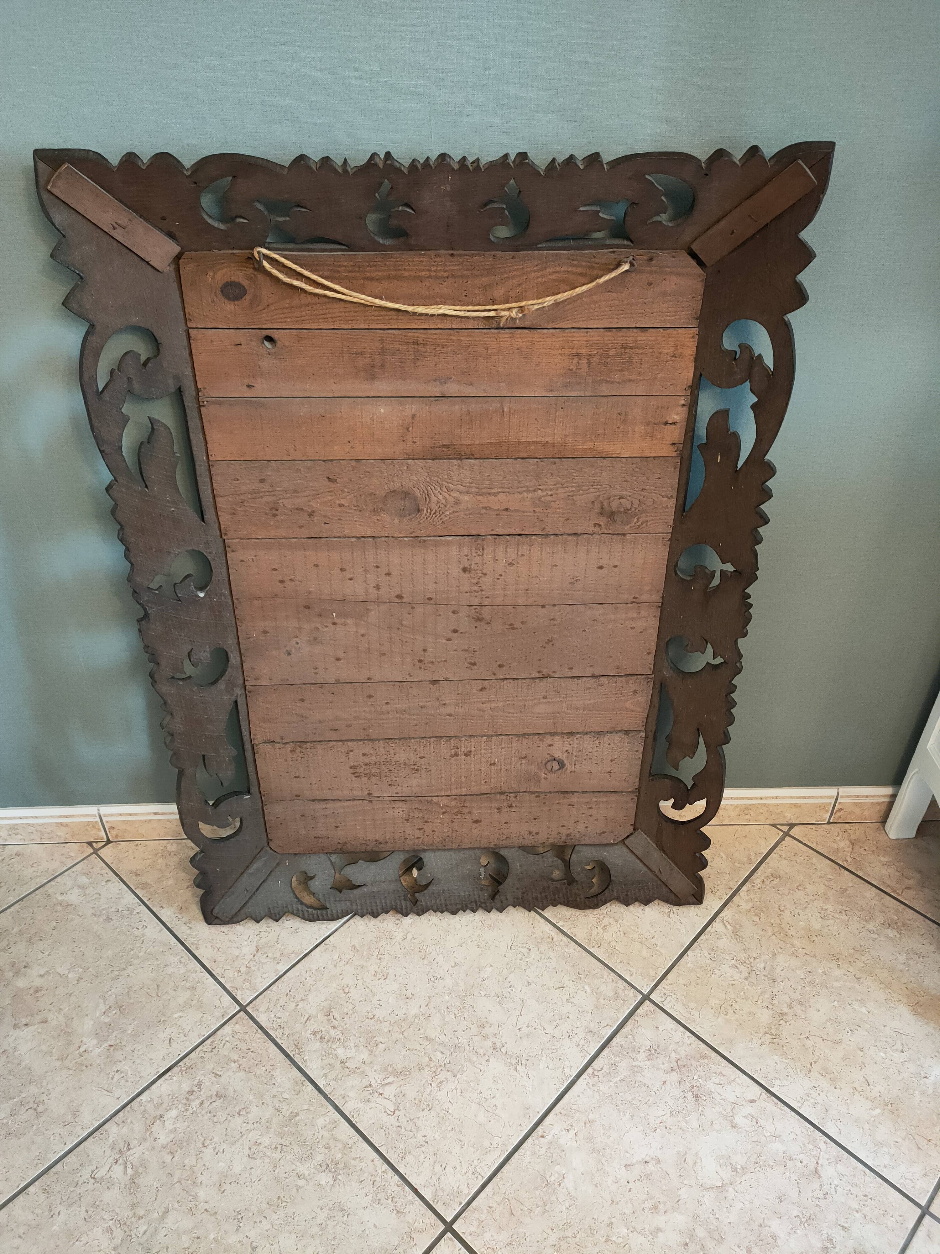 Antique mirror in openwork carved wood