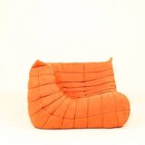Togo sofa set and armchairs in pumpkin orange, 3 pieces, no label.