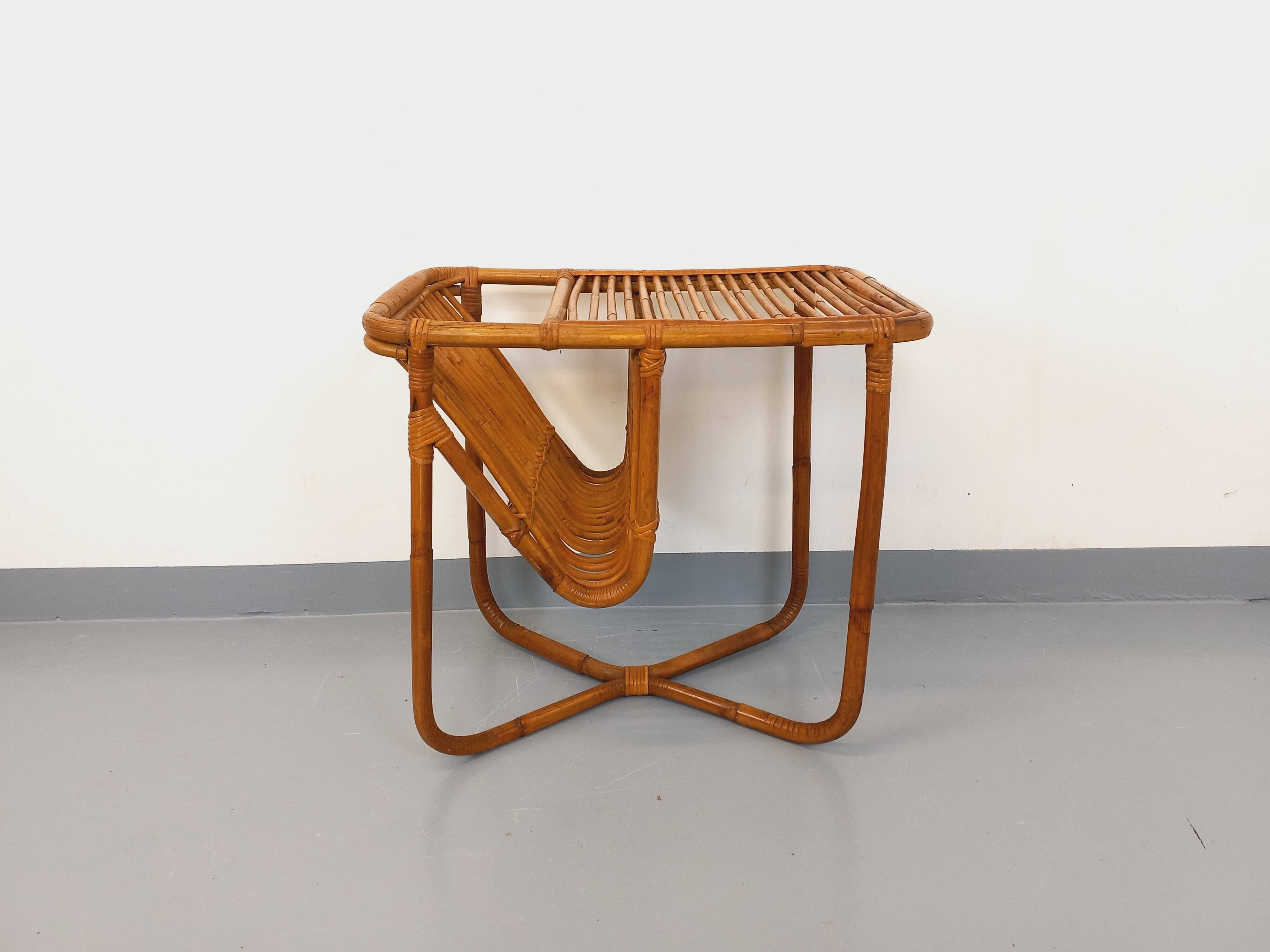Side table / coffee table with vintage 1960s rattan magazine rack.