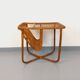 Side table / coffee table with vintage 1960s rattan magazine rack.