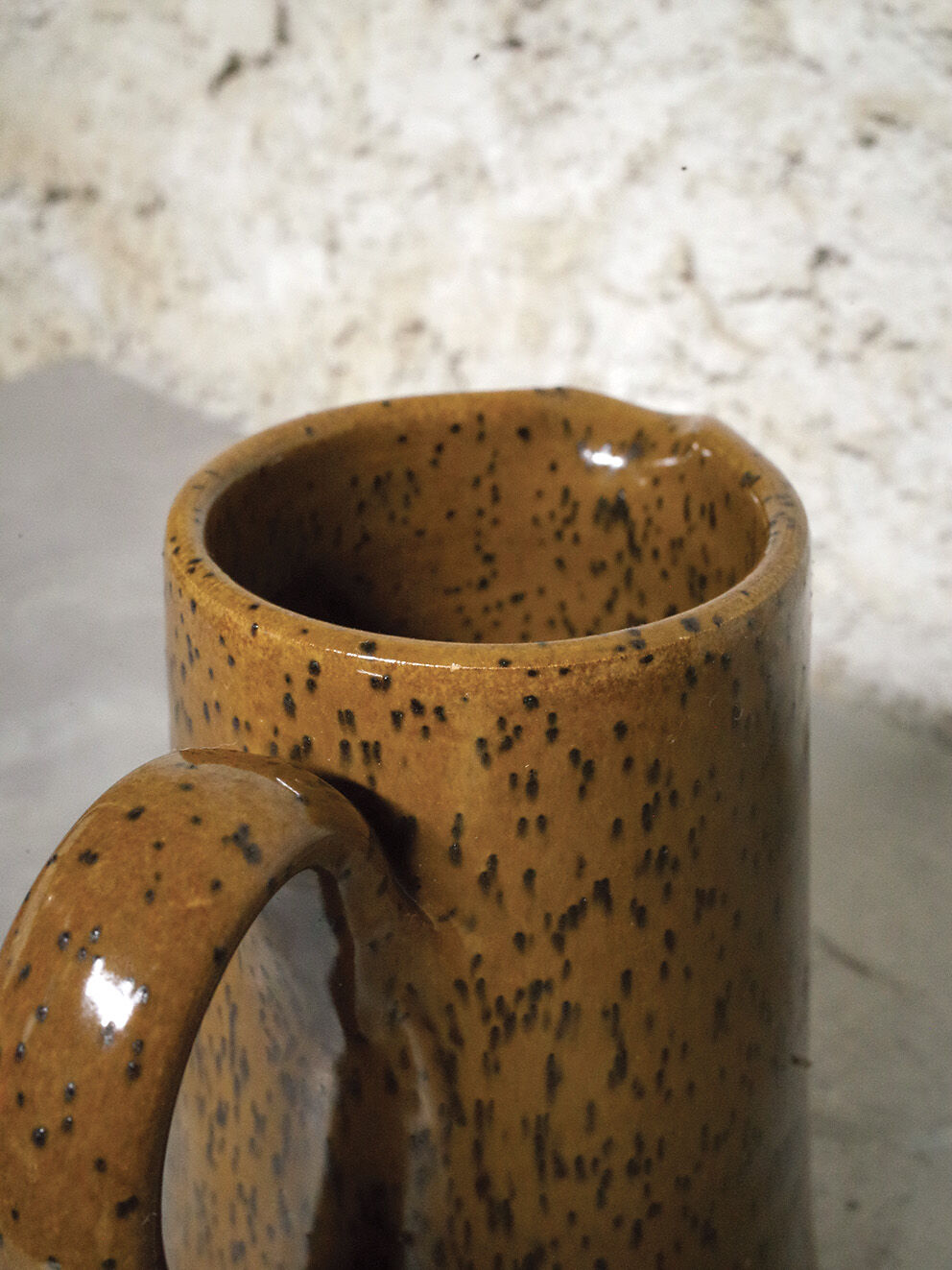 Milk pitcher in spotted sandstone