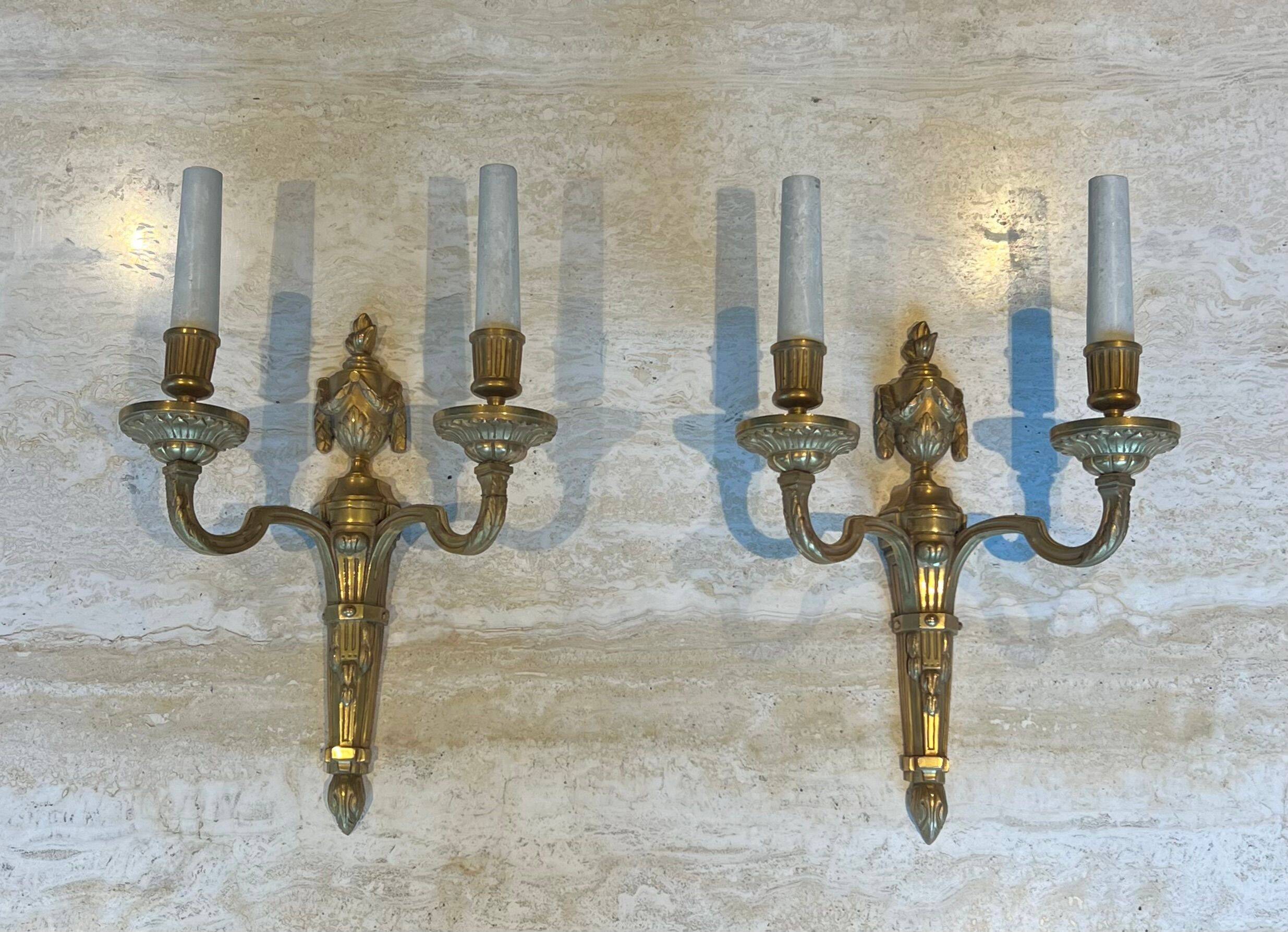 Set of 4 bronze wall lights in Louis XVI style.