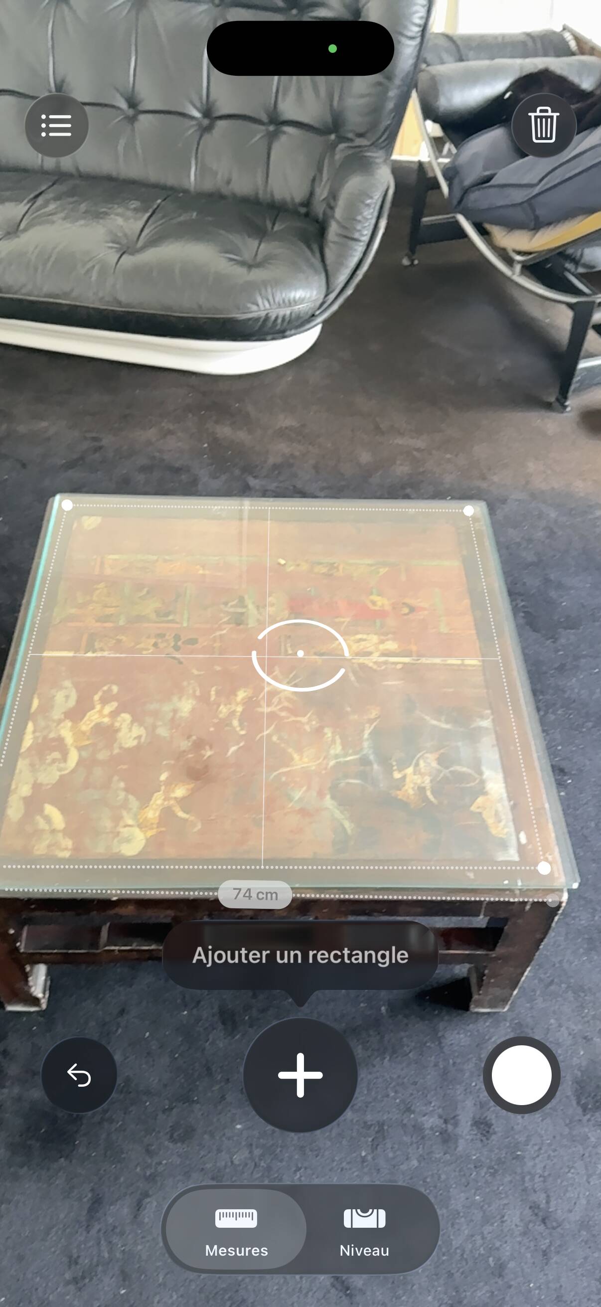 Vintage brutalist coffee table with Asian decor.