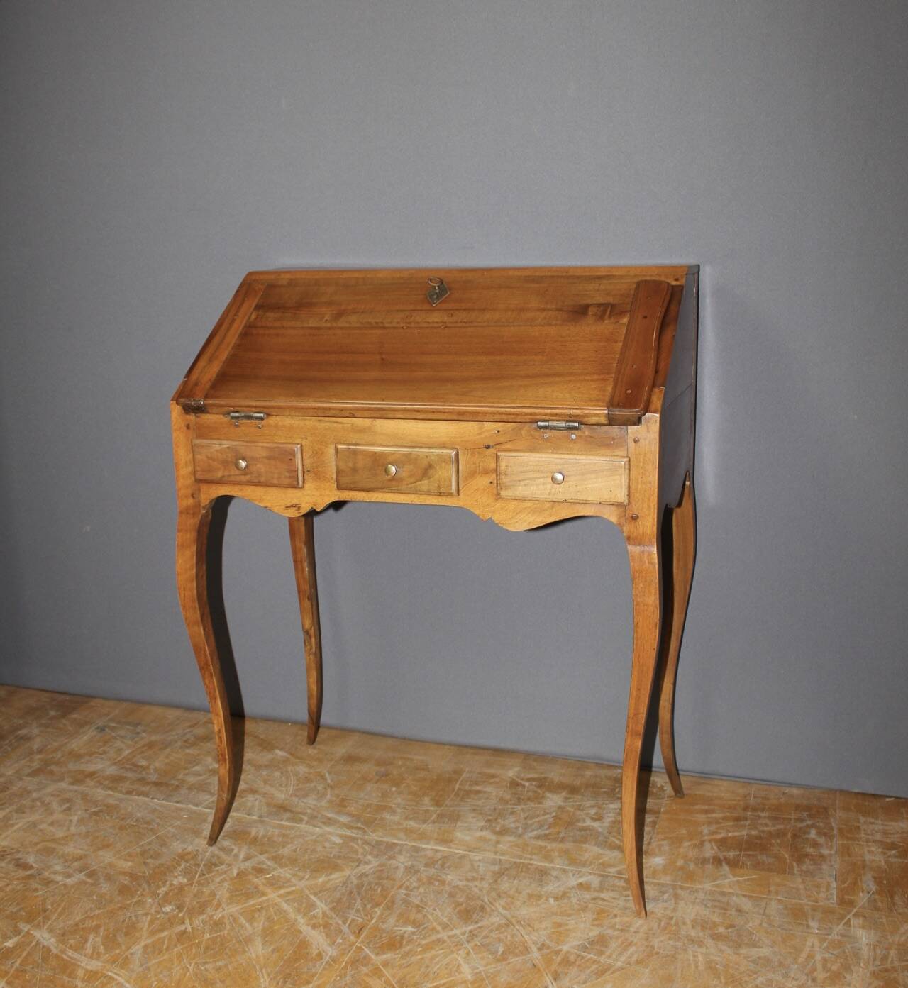 Louis XV donkey back desk in 18th century walnut