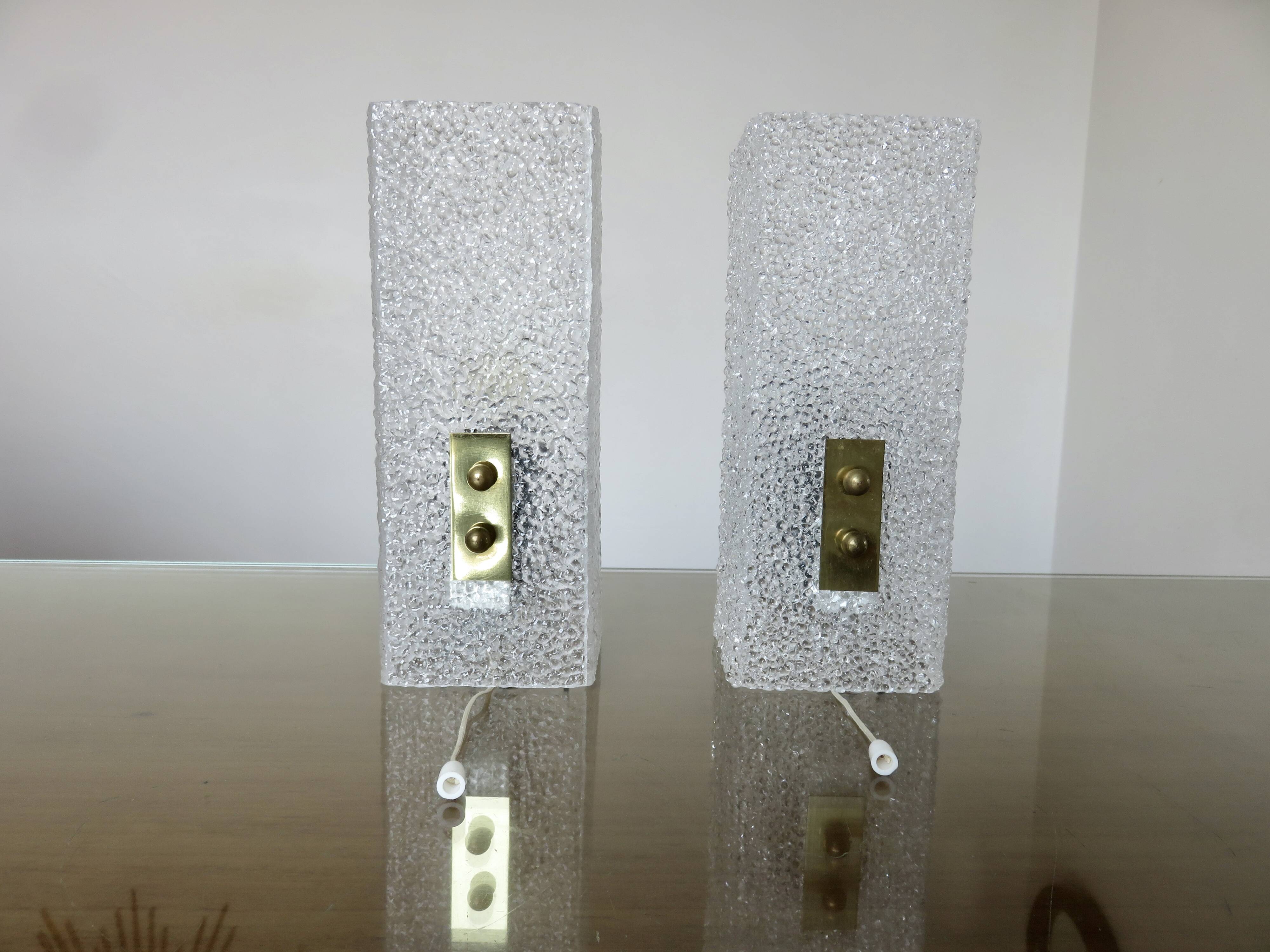 Pair of pull switch wall lights in perspex and gilded brass, France, circa 1960.
