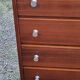 Vintage golden oak chest of drawers with 4 spindle feet from the 1950s