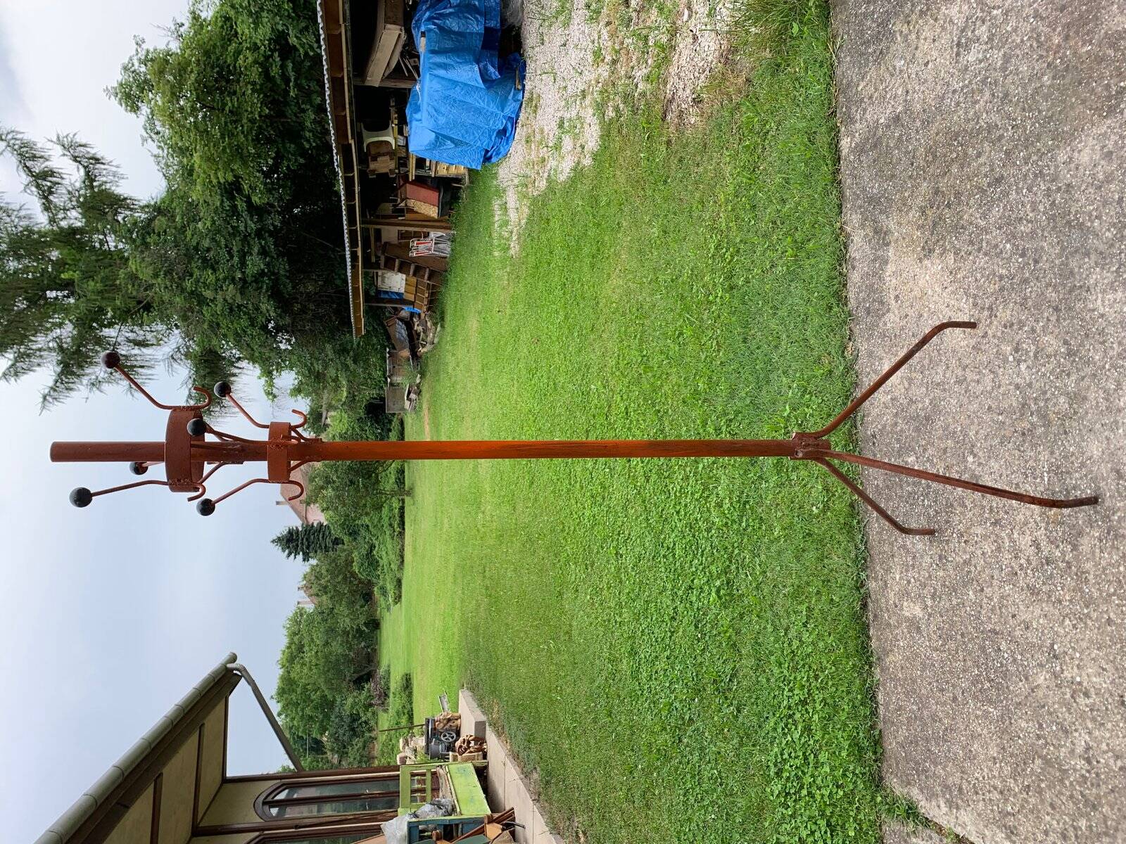 Vintage red industrial coat rack in cast iron, 1950s style, tripod base.