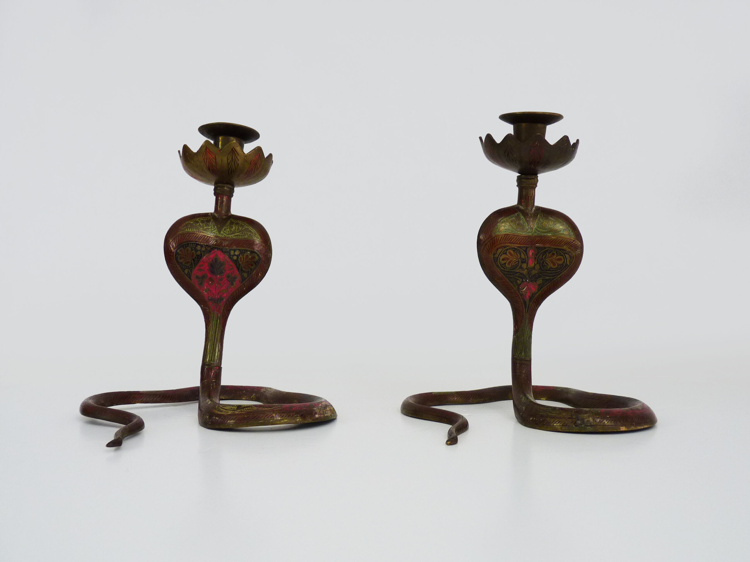 Pair of old bronze cobra candle holders with detailed engraving. Around 1950