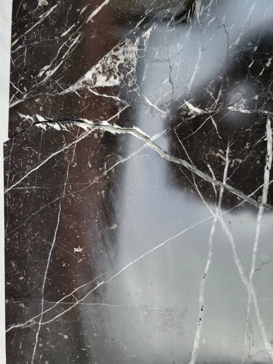 Pompadour fireplace with black marble modillions