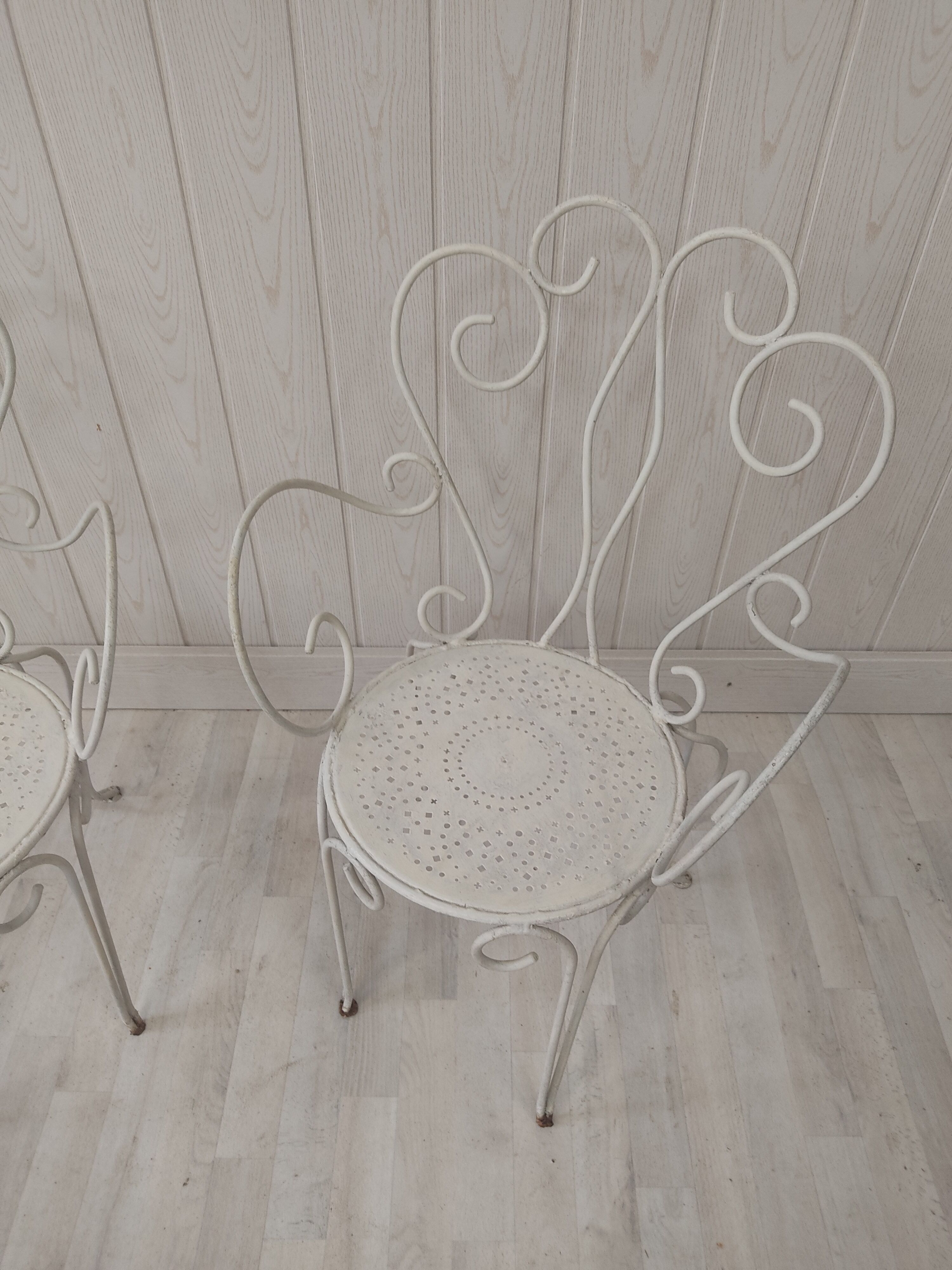 Pair of wrought iron garden chairs