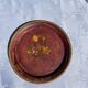 Small antique lacquered dish with hand-painted floral decoration.