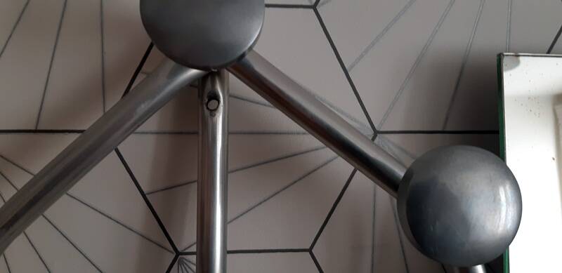 Vintage aluminum wall coat rack.