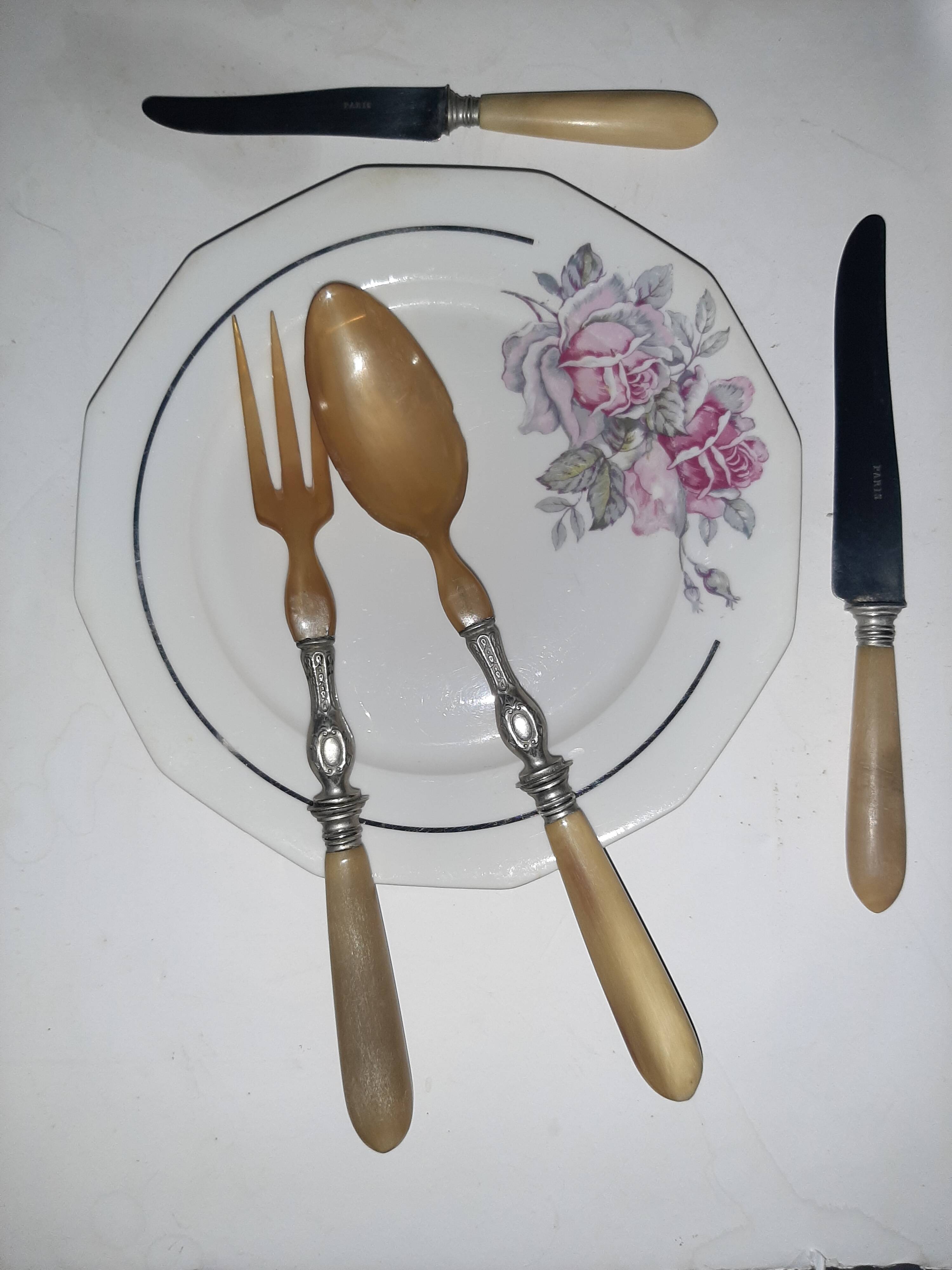 29-piece horn cutlery set, knives and serving utensils.