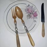 29-piece horn cutlery set, knives and serving utensils.