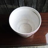 Vintage ceramic pot with hand-painted floral decoration.