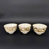 Trio of white speckled glazed stoneware bowls, gestural brown decoration – signed