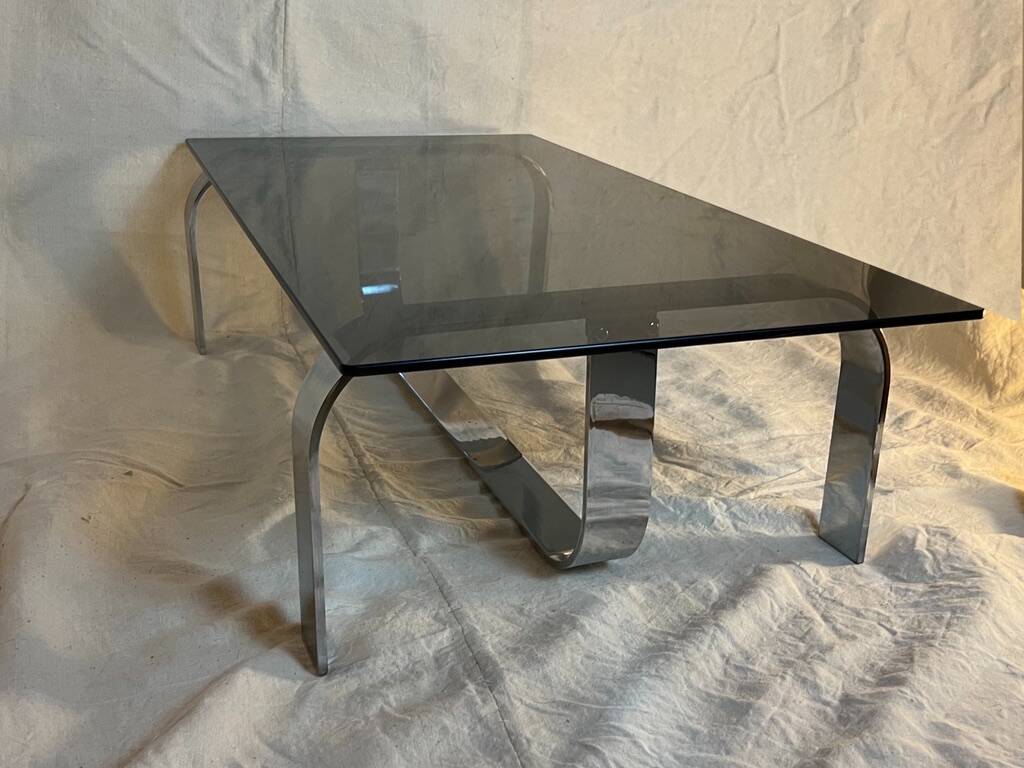 Vintage coffee table from the 70s in chrome and smoked glass, Space Age and Mid-Century style.