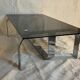 Vintage coffee table from the 70s in chrome and smoked glass, Space Age and Mid-Century style.