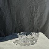 Circular glass ashtray with stylized petal patterns