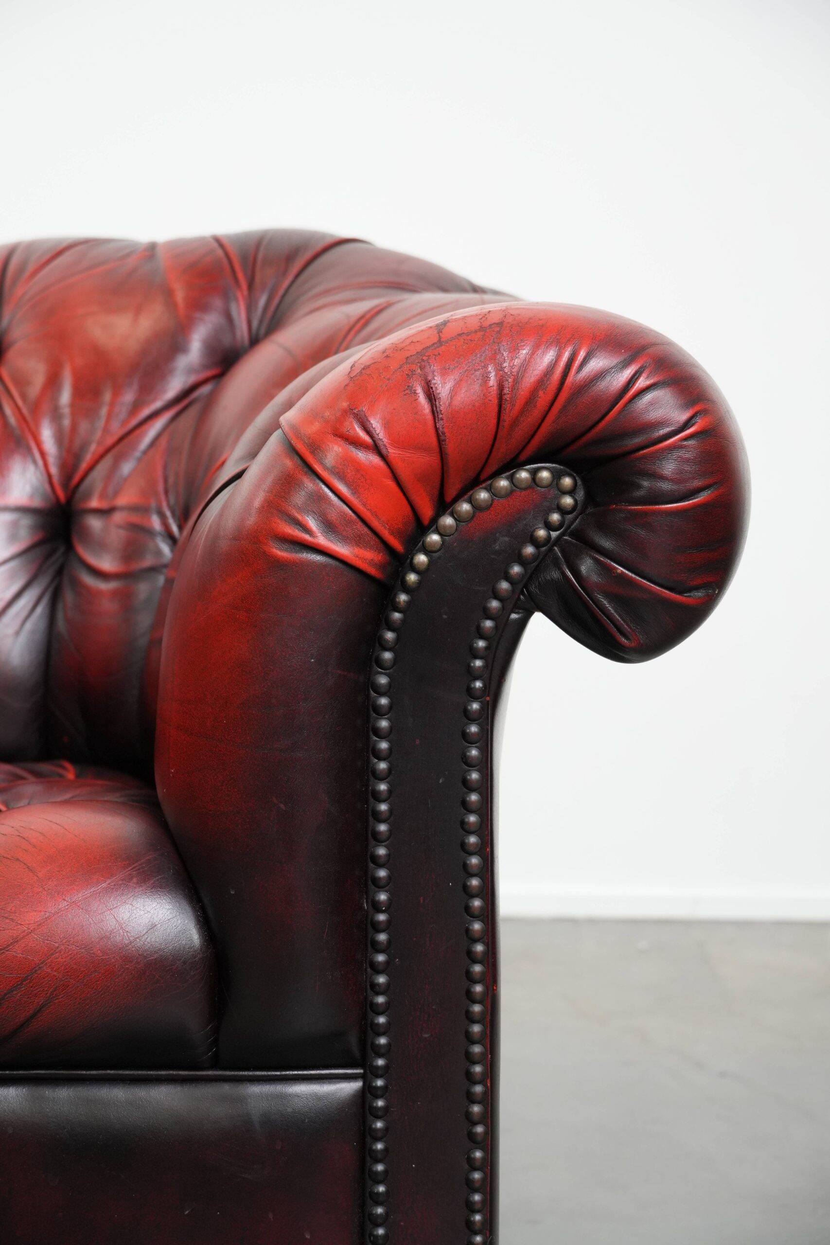 Classic cowhide Chesterfield button seat armchair in a beautiful red colour