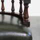 Adjustable green leather and wood Chesterfield office chair with swivel