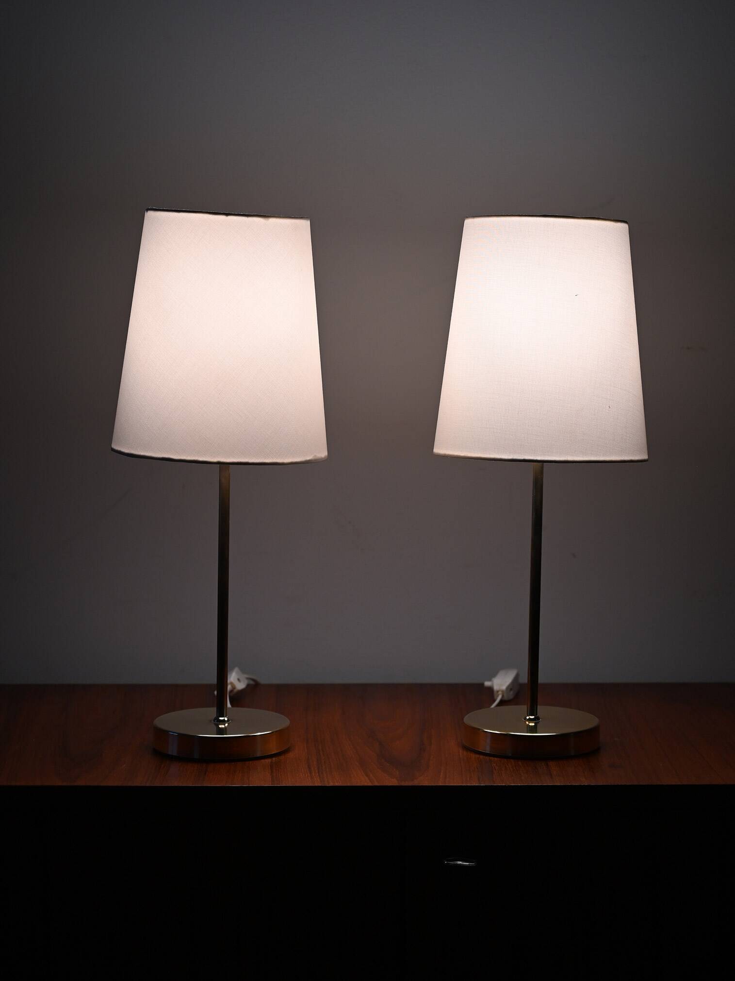 Pair of Scandinavian brass bedside lamps
